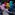 Fourteen dancers wearing bold colours spin