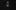 A person stands alone in a dark space wearing a black T‑shirt with a bold graphic and text on the front, illuminated from the front while the surrounding background fades into near‑blackness.