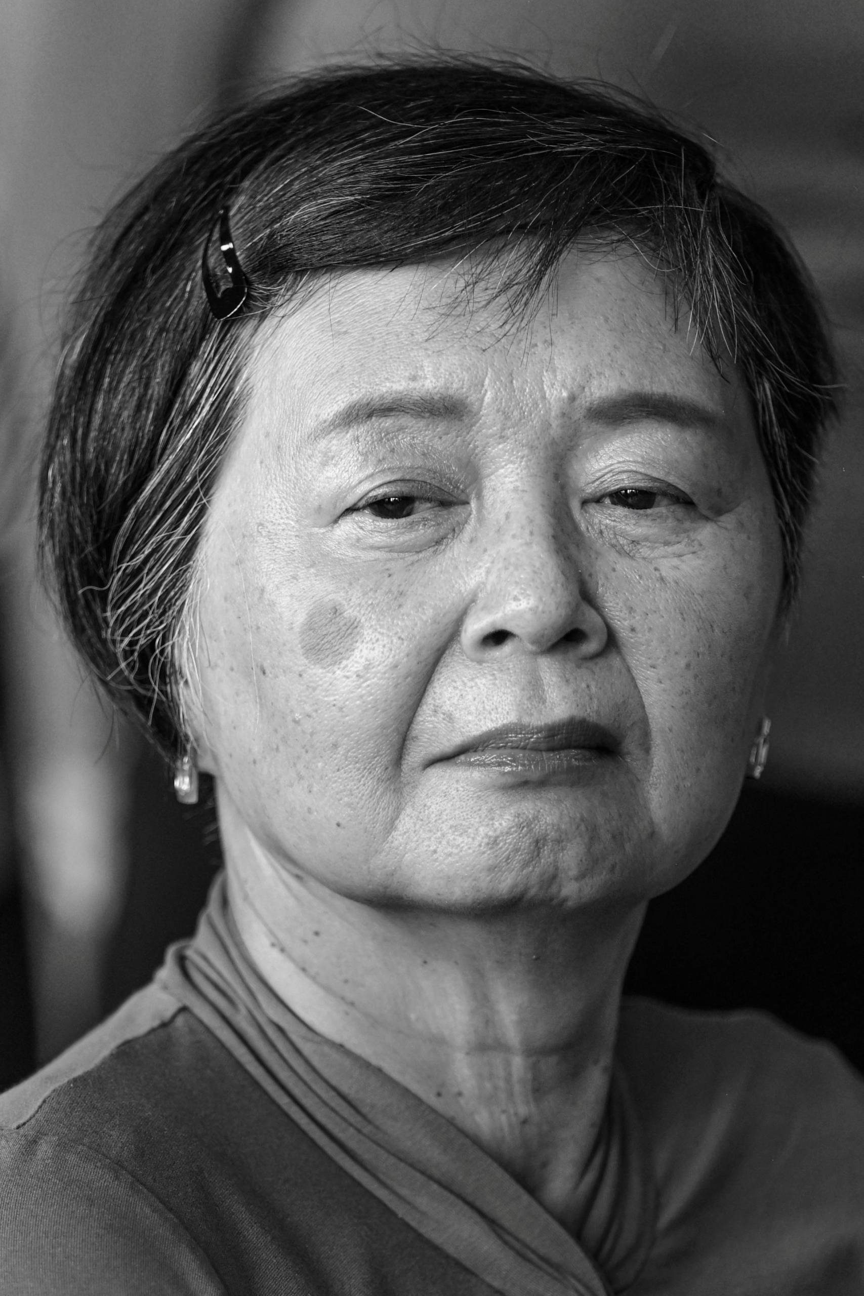 Black and white headshot of Hisami Okamoto